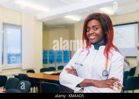 Portrait Of young afrocan-american Female Doctor In Doctor's Office Stock Photo