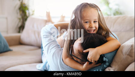 Portrait of father and daughter playing at home Stock Photo