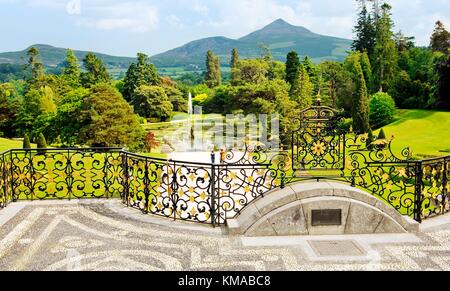Powerscourt mansion, County Wicklow, Ireland. View over the Triton Lake to Great Sugar Loaf mountain from the Italianate terrace Stock Photo