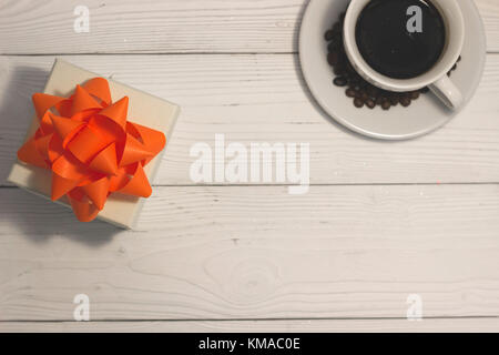 A cup of coffee on a white wooden table Stock Photo