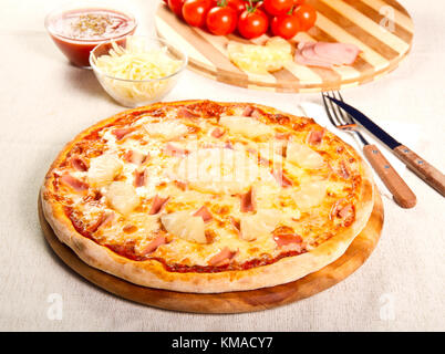 Pizza with pineapple and ham Stock Photo