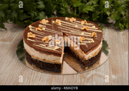 Chocolate Caramel Peanut Cake Snickers On A Plate Grey Background Close Up Stock Photo Alamy