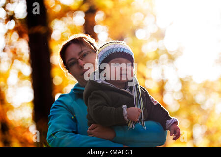 Baby boy in fall forest Stock Photo