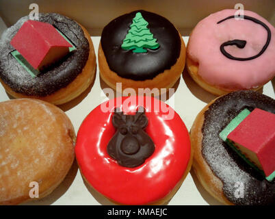 Box of Christmas Decorated Doughnuts and Pastries Stock Photo