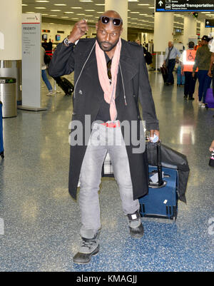 MIAMI, FL - DECEMBER 05: (EXCLUSIVE COVERAGE) Jimmy Jean-Louis at Miami International Airport. Jimmy Jean-Louis is a Haitian actor and model best known for his role as 'the Haitian' on the NBC television series Heroes on December 5, 2015 in Miami, Florida   People:  Jimmy Jean-Louis Stock Photo