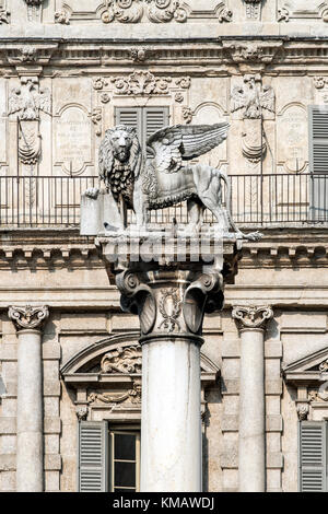 White marble column of St. Mark's Lion, symbol of the Republic of Venice, with Palazzo Maffei behind, Piazza delle Erbe square, Verona, Veneto Stock Photo
