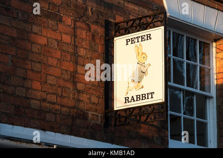 Peter Rabbit shop sign in the early morning sunlight. Stratford upon Avon, Warwickshire, England Stock Photo