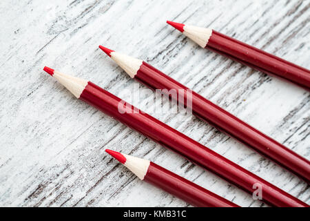 Sharpened red pencils with red body on white background Stock Photo