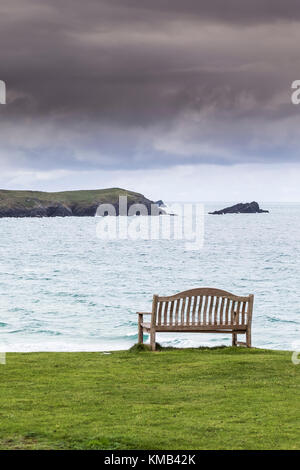 An empty bench overlooking Fistral in Newquay Cornwall UK. Stock Photo