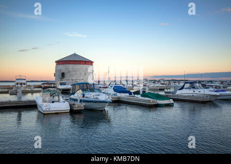 The Confederation Basin Marina and Shoal Tower which is a World War 2 Martello Tower on the St. Lawrence River in Kingston, Ontario, Canada. Stock Photo