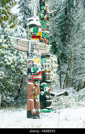 West coast First Nations totems with covering of Winter snow, Brockton Point, Stanley Park, Vancouver, British Columbia, Canada Stock Photo