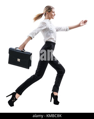 Happy young woman in formal wear jumping . Stock Photo