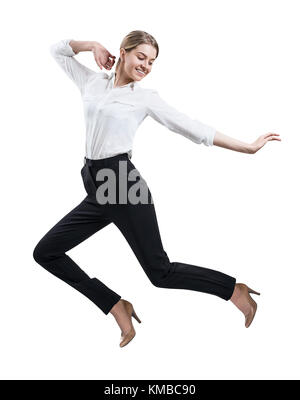 Happy young woman in formal wear jumping . Stock Photo
