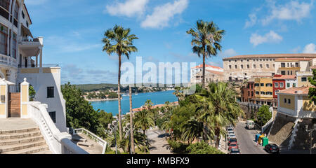 Palm trees and view of old town and port in Mahon, Menorca Stock Photo