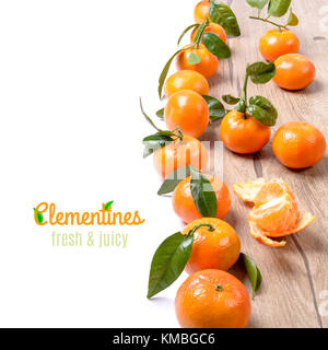 Fresh tangerines on wood isolated on white, space for your text Stock Photo