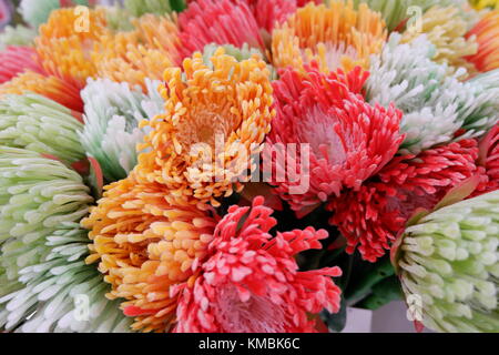 Artificial Colorful Flowers on display looking fresh and real Stock Photo