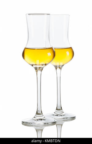 Two glasses of italian Grappa brandy isolated on white background Stock Photo