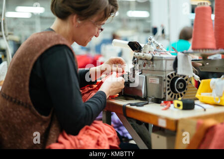 Woman working in textile industry Stock Photo