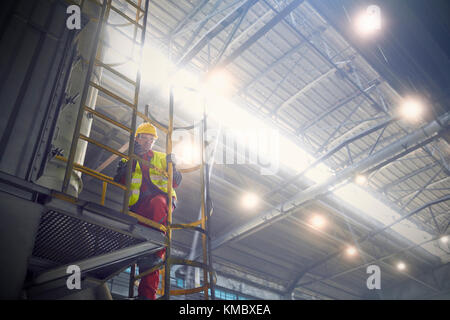 Steelworker on platform in steel mill Stock Photo