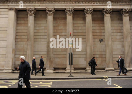 People walk past The Bank of England in London Stock Photo