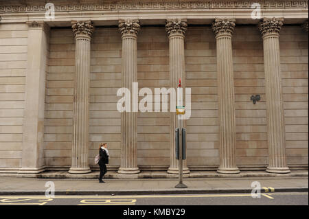 People walk past The Bank of England in London Stock Photo