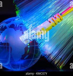 world map technology style against fiber optic background Stock Photo