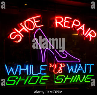 neon shoe repair sign Stock Photo