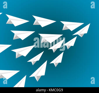 white paper planes flying on a pattern formation isolated over a blue background Stock Photo