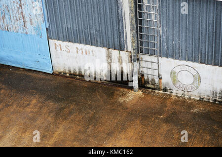 Photo of dock side with ladder and corrugated iron Stock Photo