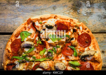 Sliced Home Made Pepperoni Pizza On Wooden Rustic Background Stock ...