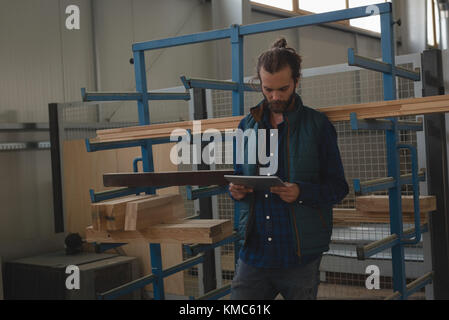 Carpenter using digital tablet Stock Photo