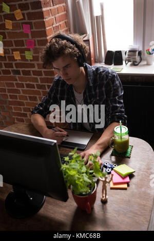 Male graphic designer working on graphic tablet Stock Photo
