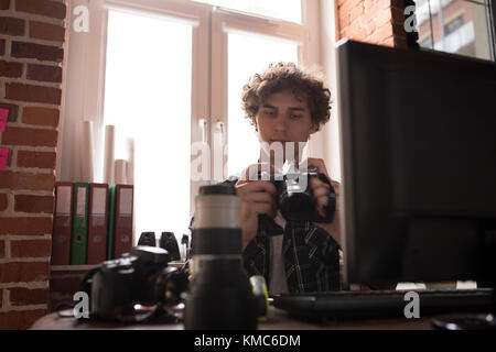 Male graphic designer using camera