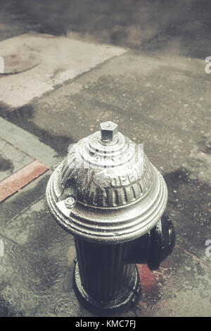 Retro stylized picture of a fire hydrant in New York City, selective focus. Stock Photo