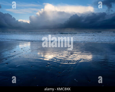 Clouds Reflected in Wet Sand on the Beach at Cayton Bay near Scarborough North Yorkshire England Stock Photo