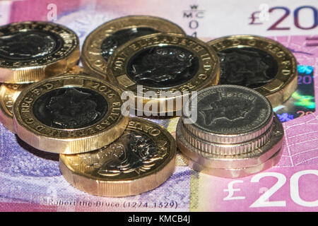 One pound coins, and twenty pence and five pence pieces, totalling £7.50, representing the UK's National Living Wage (2017) for those aged 25 and over Stock Photo