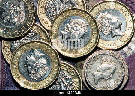 One pound coins, and twenty pence and five pence pieces, totalling £7.50, representing the UK's National Living Wage (2017) for those aged 25 and over Stock Photo