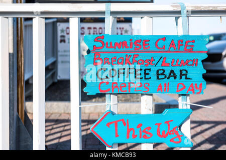 Bar Harbor, USA - June 8, 2017: Closeup of sign for oceanfront restaurant, cafe called Sunrise Cafe in downtown village in summer serving crepes Stock Photo