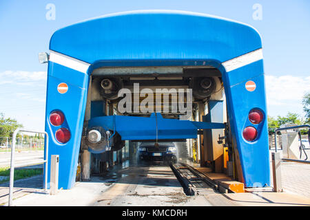 Automated portal carwash with a car running through Stock Photo