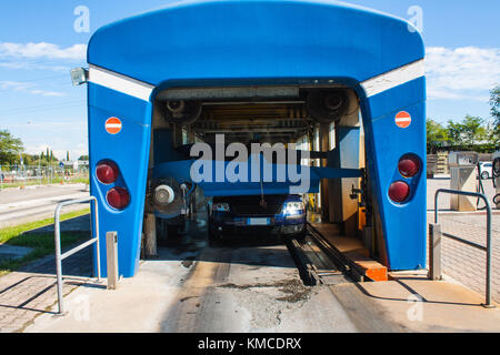 Automated portal carwash with a car running through Stock Photo