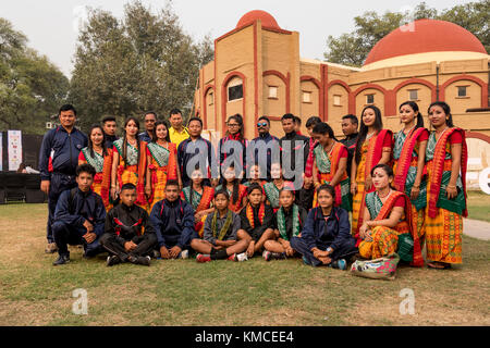 Group of girls from north eastern states standing wearing ethnic dresses along with martial arts team. Stock Photo