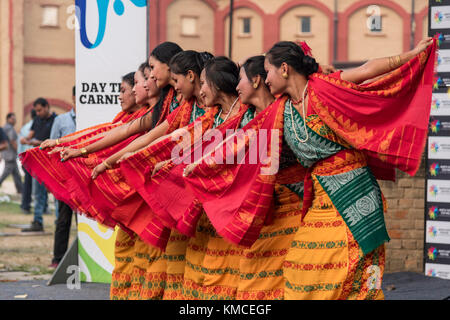 Group of girls from north eastern states dancing in a row wearing ethnic dresses. Stock Photo