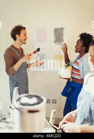 Young couple painting wall Stock Photo
