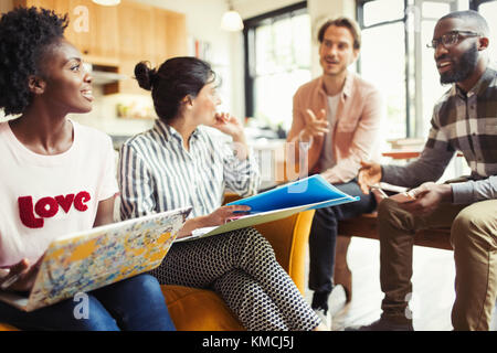 Creative business people discussing paperwork Stock Photo