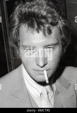 File. 6th Dec, 2017. France's biggest rock star JOHNNY HALLYDAY (born June 15, 1943 died December 6, 2017) has died from lung cancer, his wife says. He was 74. The singer, real name Jean-Philippe Smet, sold about 100 million records and starred in a number of films. He was made a Chevalier of the Legion D'Honneur by President Jacques Chirac in 1997. PICTURED: Nov 10, 1969 - Paris, France - JOHNNY HALLYDAY returns to France with a black eye after staring in the film ''Weapons of Anger'' in Egypt.(Credit Image: © Keystone Press Agency/Keystone USA via ZUMAPRESS.com) Stock Photo