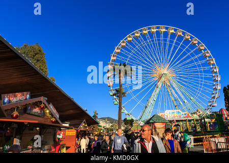 Place Masséna, Nice, France, 5th December 2017. People enjoy a beautifully sunny day with clear blue skies at the Nice Christmas Market. Credit: Imageplotter News and Sports/Alamy Live News Credit: Imageplotter News and Sports/Alamy Live News Stock Photo