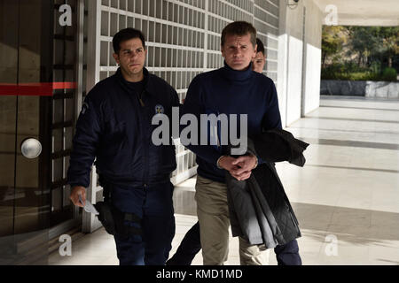Athens, Greece, 6th Dec. 2017. Police officers escort Russian bitcoin fraud suspect Alexander Vinnik as he leaves Supreme Court following a hearing of his appeal against extradition to the US in Athens, Greece. Credit: Nicolas Koutsokostas/Alamy Live News Stock Photo
