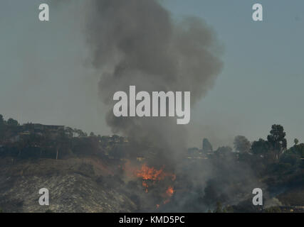 Dec 6, 2017. Bel-Air Ca. Firefighters raced to a fast-moving brush fire that broke out early Wednesday morning near Skirball Center in the Sepulveda Pass. The northbound 405 Freeway was closed for several hours and burning at least four homes in the Bel-Air area know for it's multi-million dollar mansions.The Skirball fire was at 4:52 a.m. on the east side of the freeway and quickly grew to 150 acres by 10 a.m. as crews were working against 15 to 25 mph winds. By 3 p.m. the fire had grown to 475 acres. Photo by Gene Blevins/LA DailyNews Credit: Gene Blevins/ZUMA Wire/Alamy Live News Stock Photo