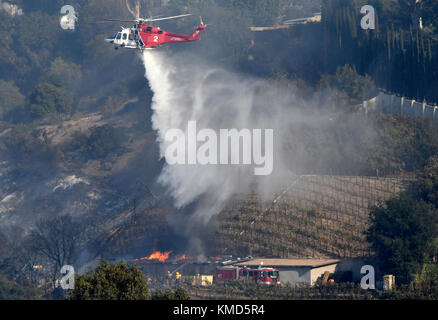 Dec 6, 2017. Bel-Air Ca. LA city firefighters try to save a winery storage building that is own by billionaire Rupert Murdoch Wednesday. The Skirball fire was at 4:52 a.m. on the east side of the freeway and quickly grew to 150 acres by 10 a.m. as crews were working against 15 to 25 mph winds. By 3 p.m. the fire had grown to 475 acres. Photo by Gene Blevins/LA DailyNews/Zuma Press Credit: Gene Blevins/ZUMA Wire/Alamy Live News Stock Photo