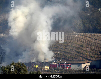 Dec 6, 2017. Bel-Air Ca. LA city firefighters try to save a winery storage building that is own by billionaire Rupert Murdoch Wednesday. The Skirball fire was at 4:52 a.m. on the east side of the freeway and quickly grew to 150 acres by 10 a.m. as crews were working against 15 to 25 mph winds. By 3 p.m. the fire had grown to 475 acres. Photo by Gene Blevins/LA DailyNews/Zuma Press Credit: Gene Blevins/ZUMA Wire/Alamy Live News Stock Photo